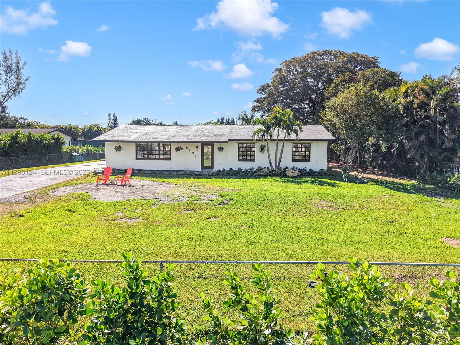 6231 Southwest 188th Avenue Southwest Ranches, FL 33332 - Photo 6 of 40 a view of a house with a big yard