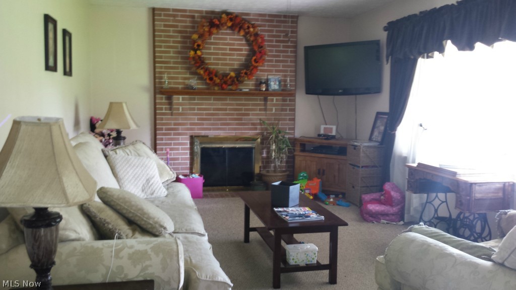 3727 Cook Road Rootstown, OH 44272 - Photo 6 of 8 Living room with wood burning fireplace