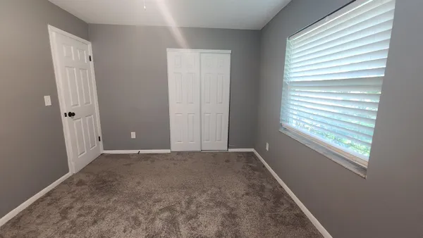an empty room with windows