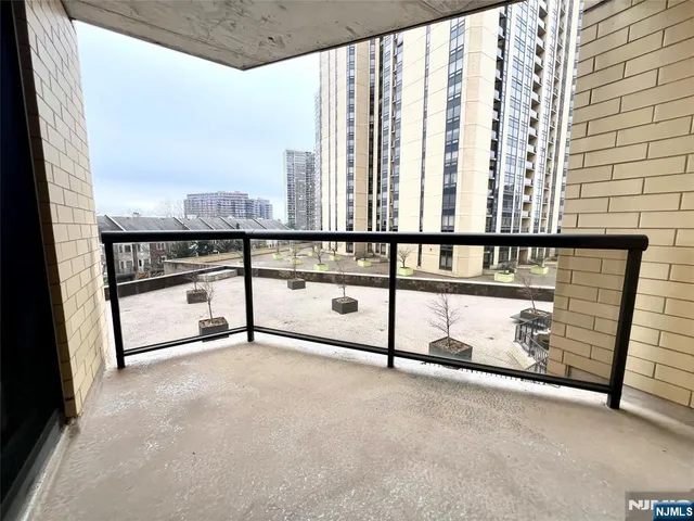a view of balcony with furniture and city view