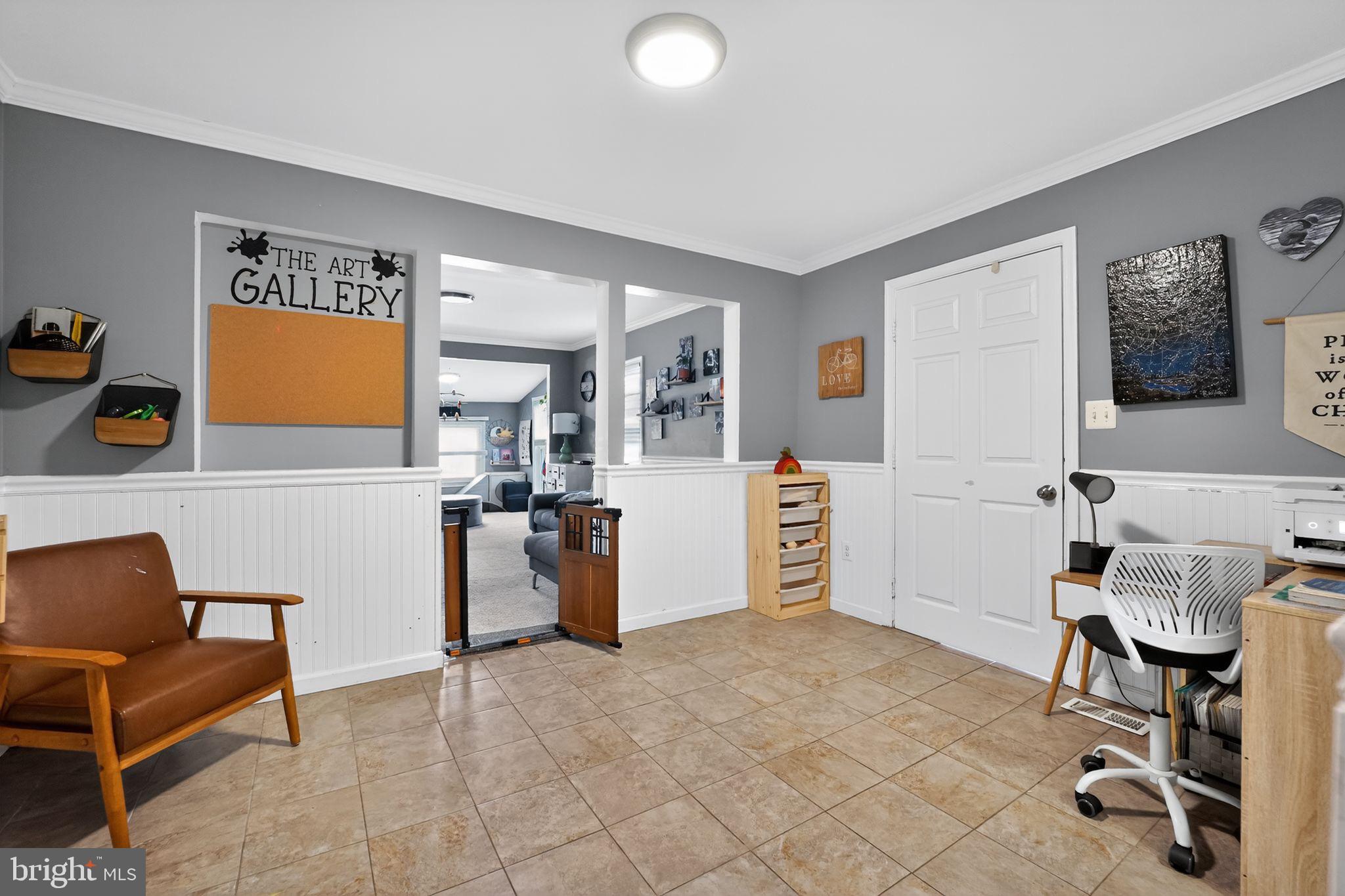 7819 Bertha Road Pasadena, MD 21122 - Photo 11 of 31 a view of a livingroom with furniture and a chair