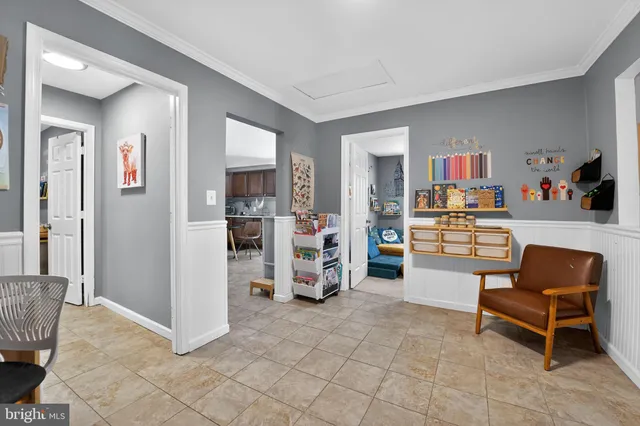 a room with furniture and white walls