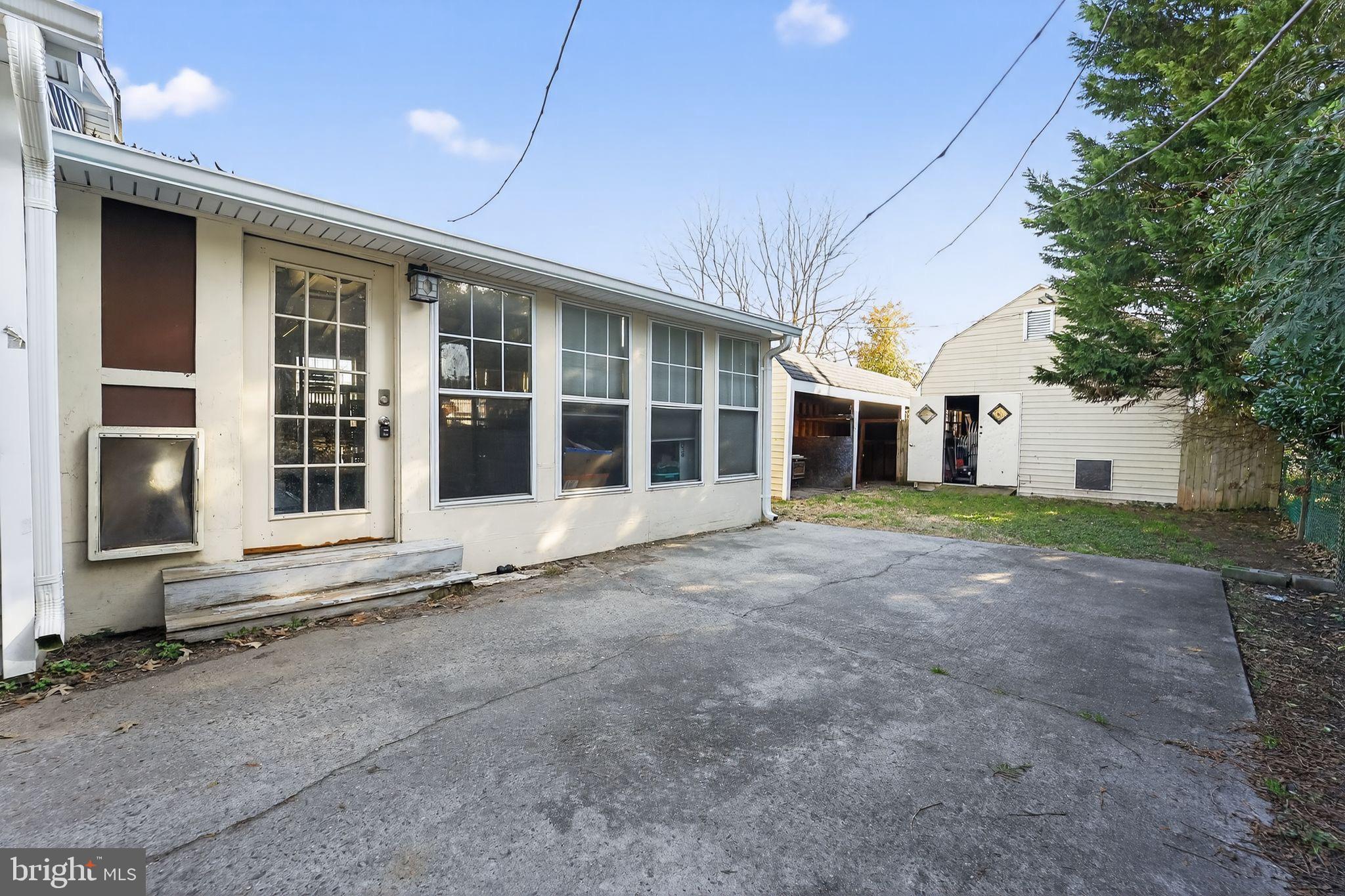 7819 Bertha Road Pasadena, MD 21122 - Photo 29 of 31 a view of a house with a garden