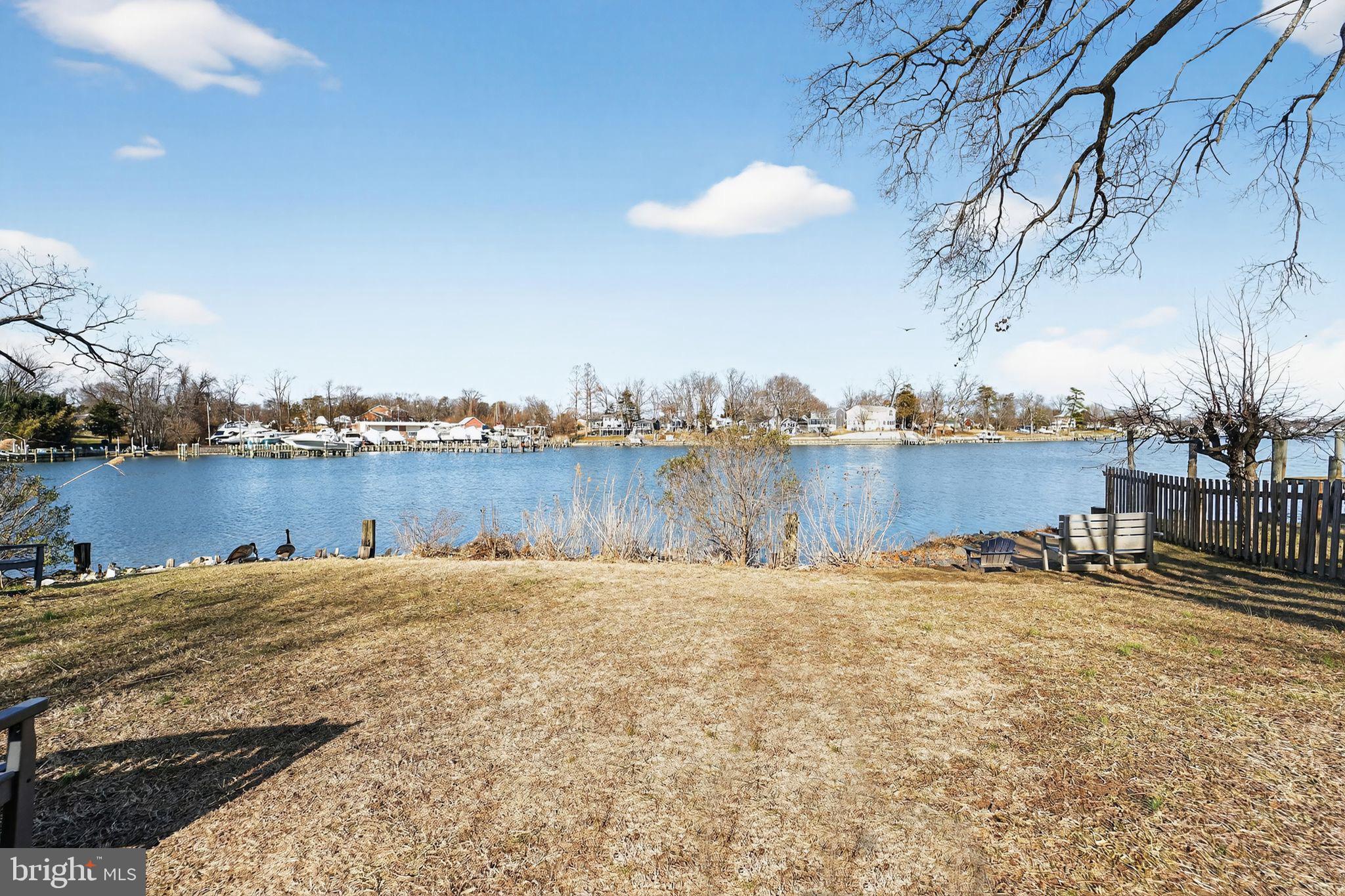 7819 Bertha Road Pasadena, MD 21122 - Photo 30 of 31 a view of a lake with houses