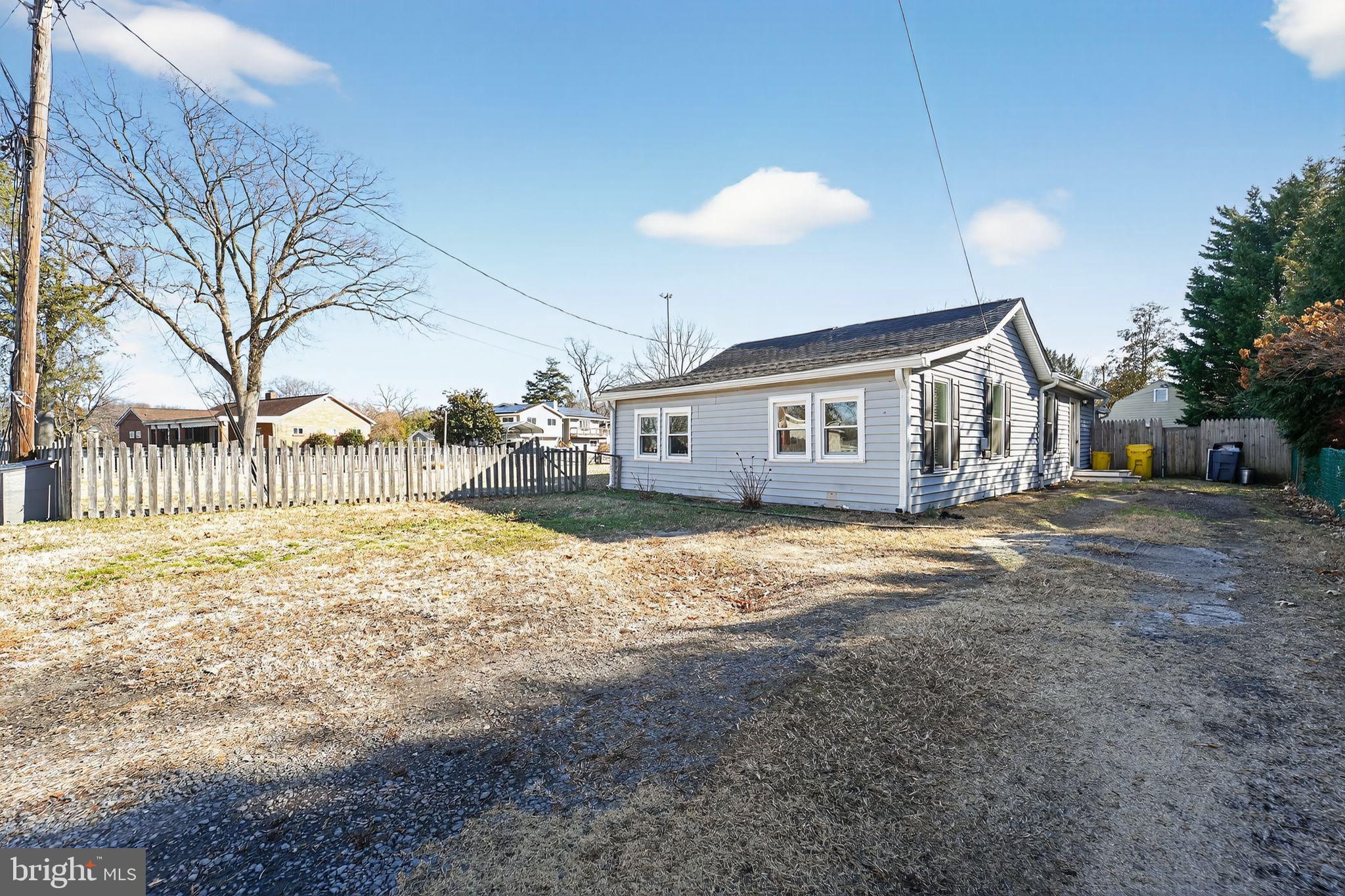 7819 Bertha Road Pasadena, MD 21122 - Photo 3 of 31 a view of a house with snow on the road