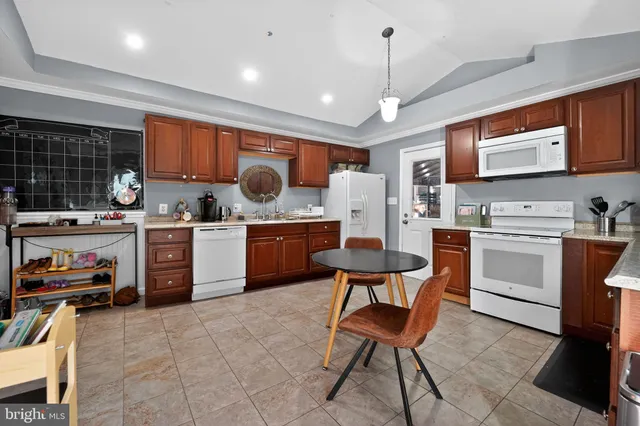 a kitchen with a sink stainless steel appliances and cabinets