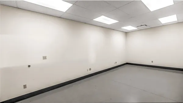 an aerial view of a room with gym equipment