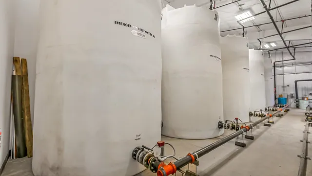 a kitchen with stainless steel appliances kitchen island granite countertop a refrigerator and a stove top oven