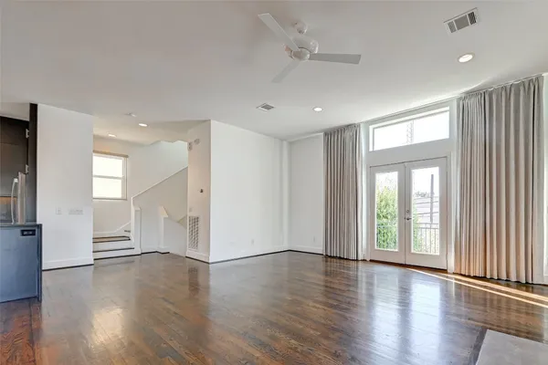 a view of an entryway with wooden floor