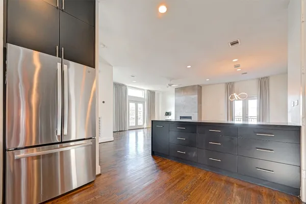 a kitchen with granite countertop a stove and a microwave