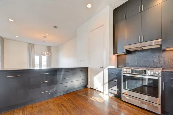 a bathroom with a sink a mirror and shower