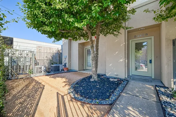 a view of entryway with wooden floor and door