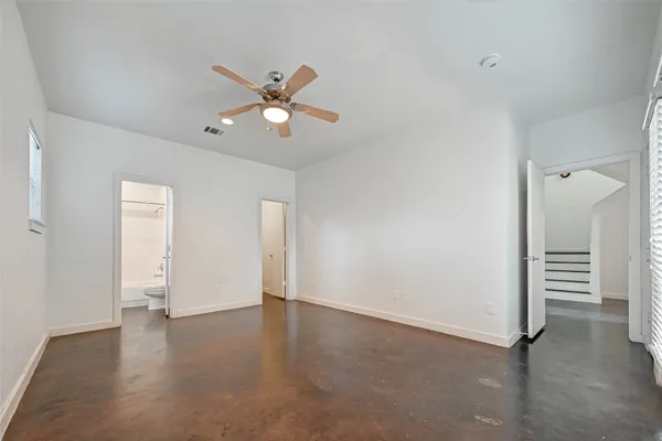 a bathroom with a granite countertop tub sink and mirror