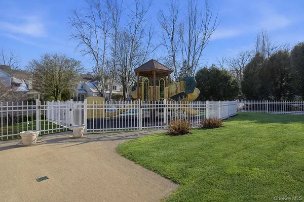 a view of a deck and yard with green space