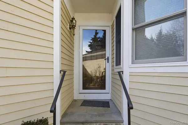 a view of a door and front door of a house