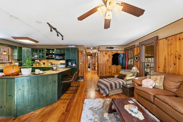 a bathroom with a sink and mirror with painted walls