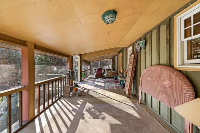 a view of a house with backyard porch and sitting area