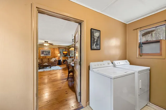 a living room with lots of furniture and a large window
