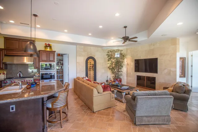 a living room with fireplace furniture and a flat screen tv