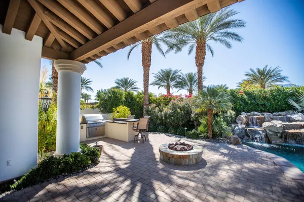 a view of a patio and fire pit