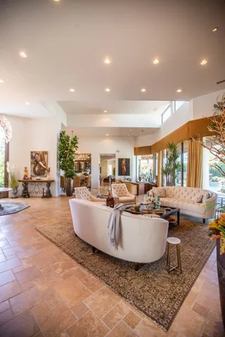 a living room with furniture and a table