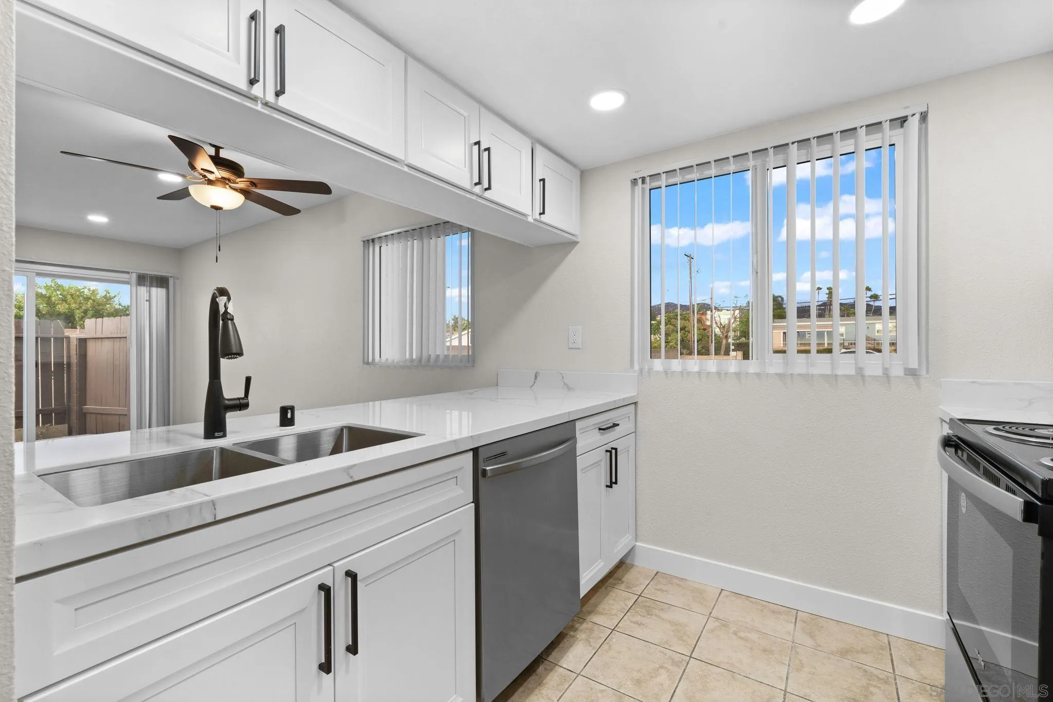748 North 3rd Street, Unit Q El Cajon, CA 92021 - Photo 4 of 16 a kitchen with appliances cabinets and a sink