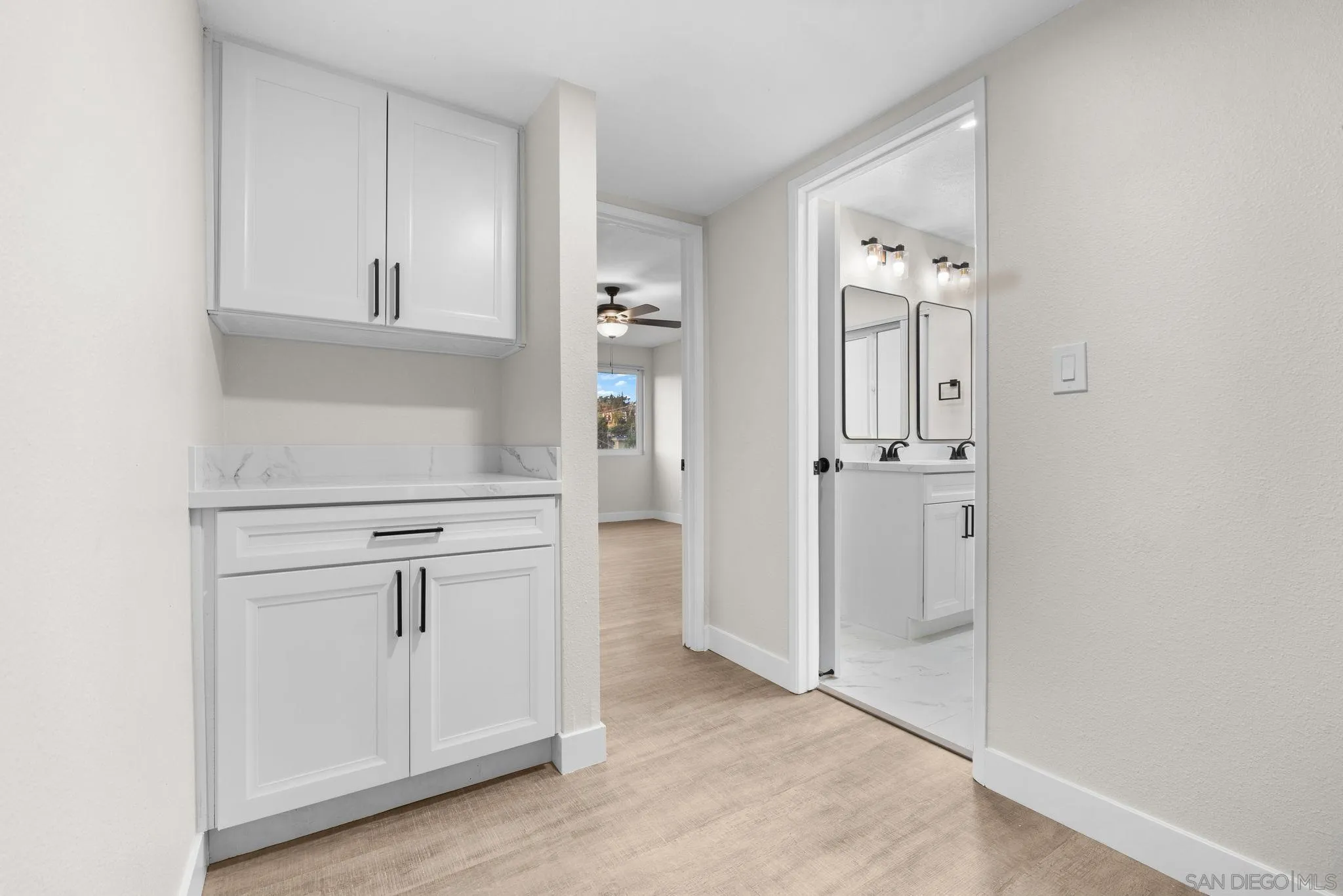 748 North 3rd Street, Unit Q El Cajon, CA 92021 - Photo 8 of 16 a view of cabinets and wooden floor