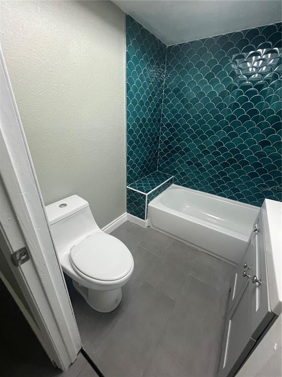 7222 Tropical Drive Weeki Wachee, FL 34607 - Photo 12 of 23 a bathroom with a toilet and a sink