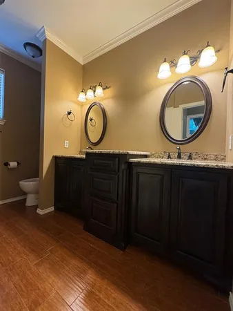 an empty room with a ceiling fan and window