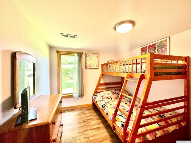 a view of a balcony with furniture and floor to ceiling window