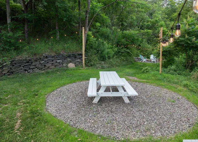 a view of a backyard with plants and outdoor