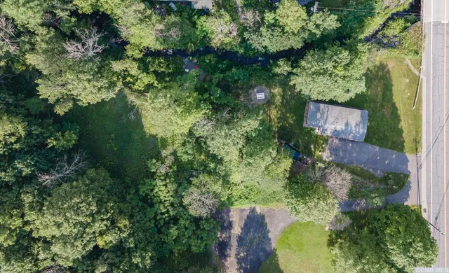 an aerial view of a house with pool yard outdoor seating and yard