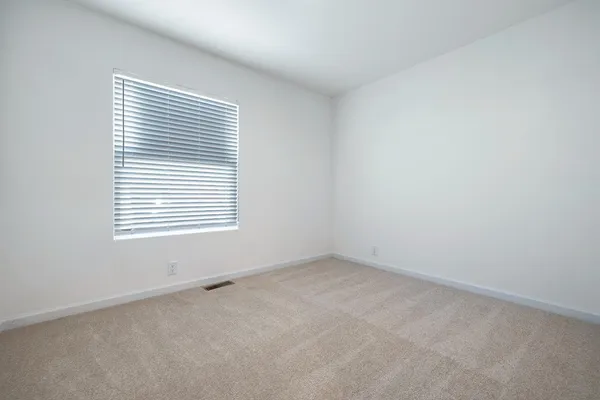 an empty room with closet area