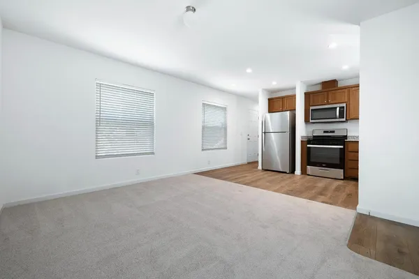 a view of a kitchen with a stove cabinets and a kitchen