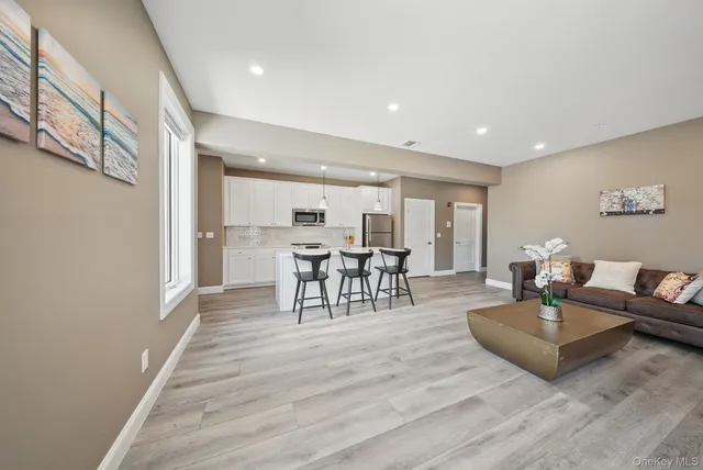 a kitchen with a sink and a stove top oven