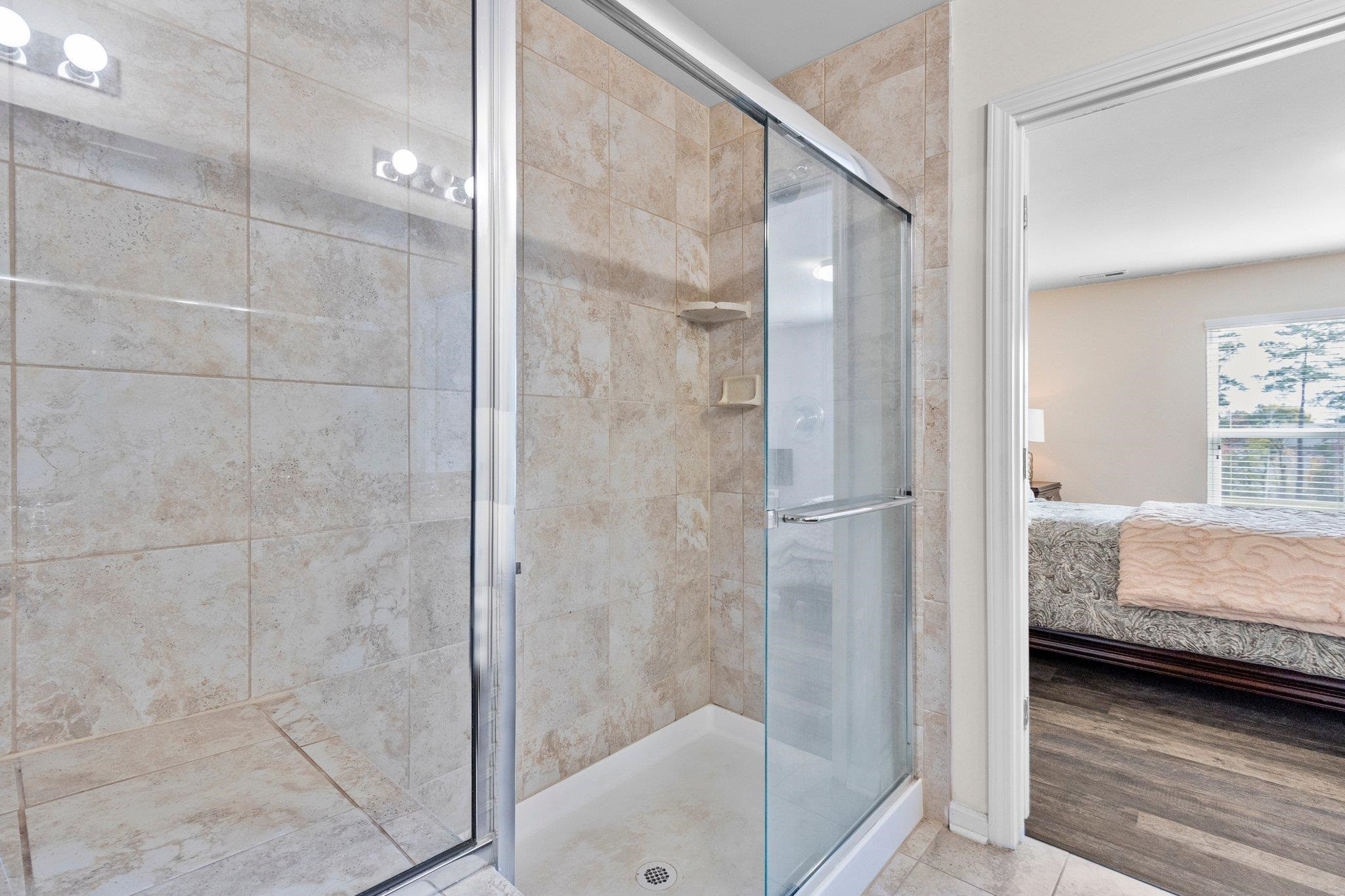 1022 Saffron Loop Durham, NC 27713 - Photo 15 of 22 a bathroom with a shower and a sink