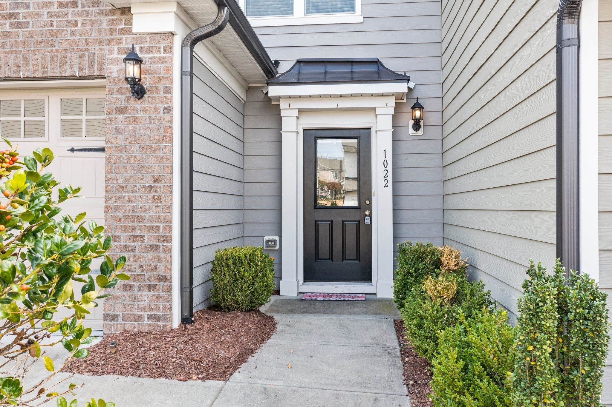 1022 Saffron Loop Durham, NC 27713 - Photo 2 of 22 a view of front door of a house