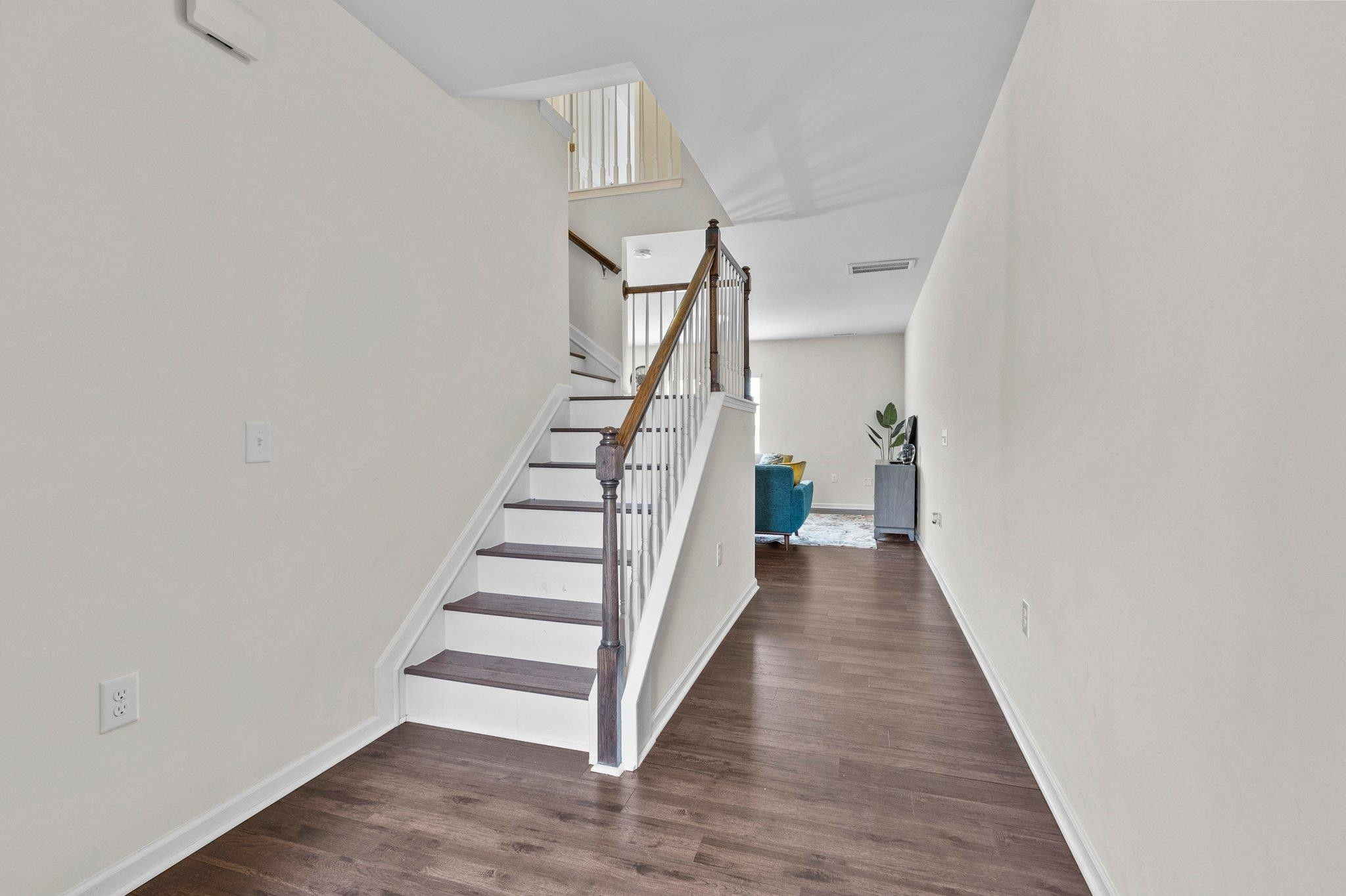 1022 Saffron Loop Durham, NC 27713 - Photo 3 of 22 a view of a hallway with wooden floor and entryway