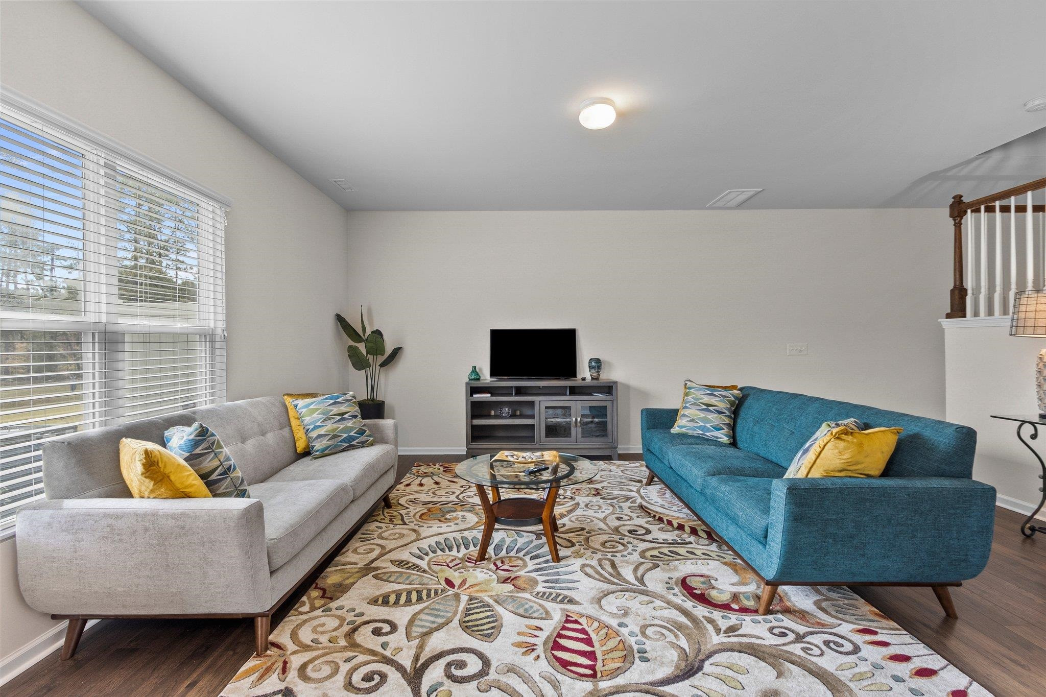 1022 Saffron Loop Durham, NC 27713 - Photo 6 of 22 a living room with furniture and a flat screen tv