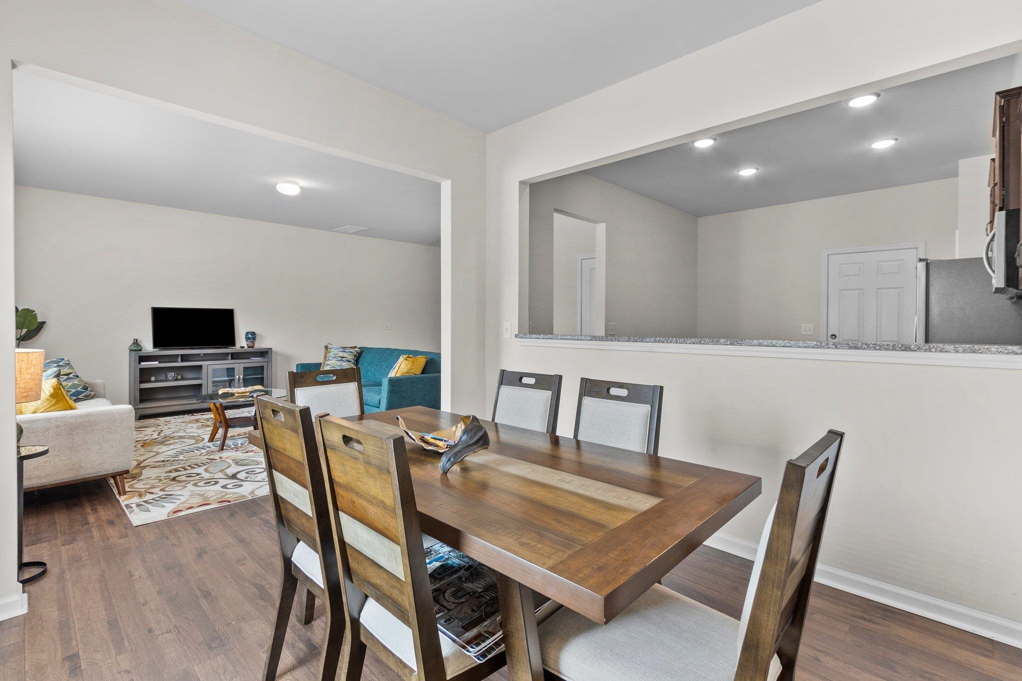 1022 Saffron Loop Durham, NC 27713 - Photo 8 of 22 a view of a dining room with furniture and wooden floor