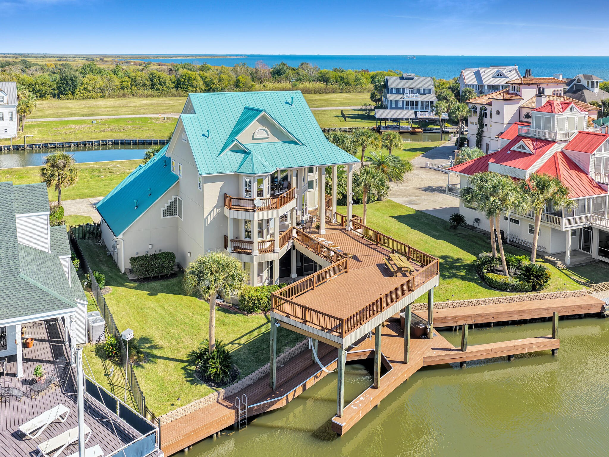 425 Island Way Port Arthur, TX 77640 - Photo 3 of 49 a aerial view of a house with swimming pool outdoor seating
