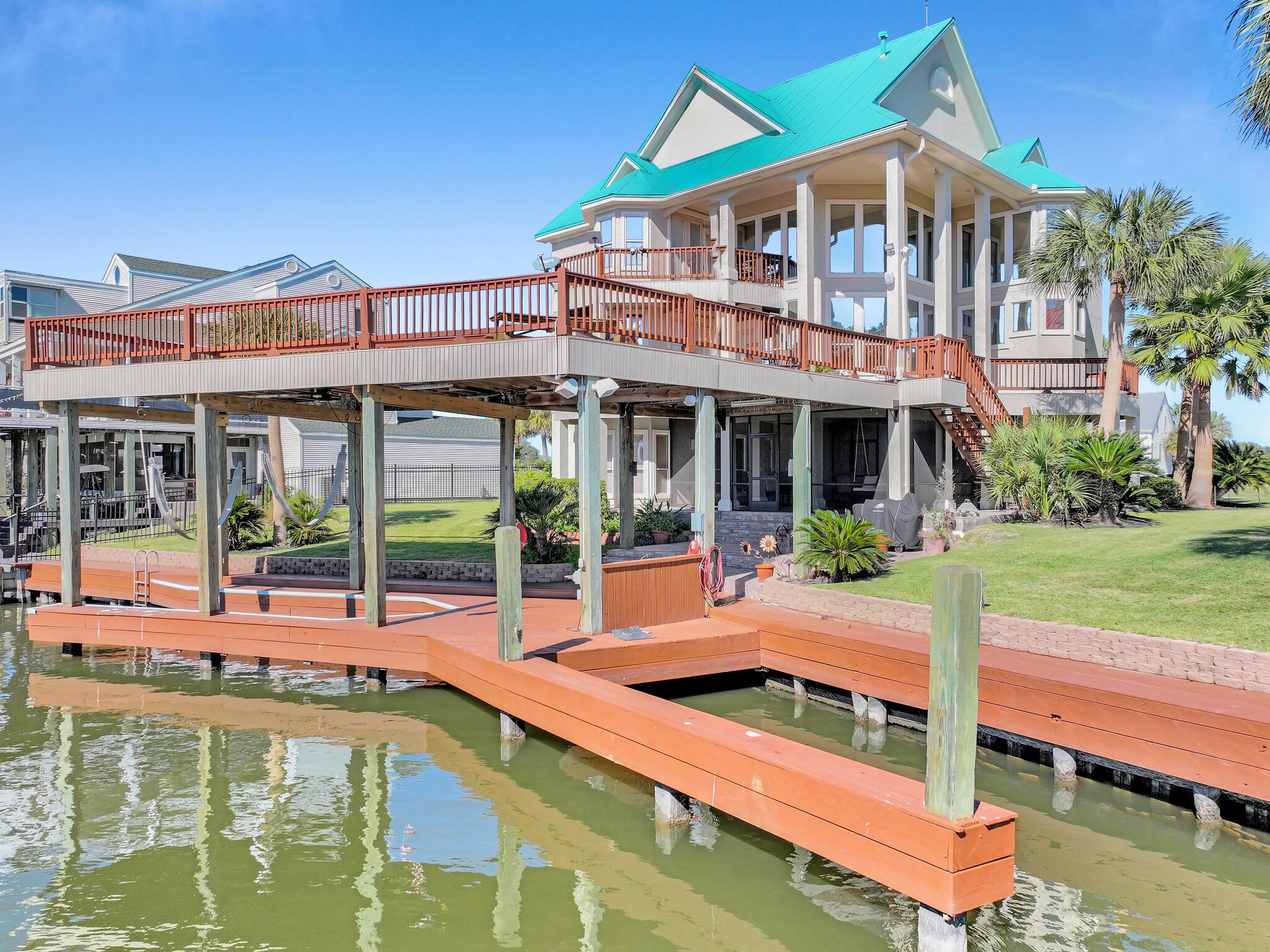 425 Island Way Port Arthur, TX 77640 - Photo 5 of 49 a view of a house with pool and chairs
