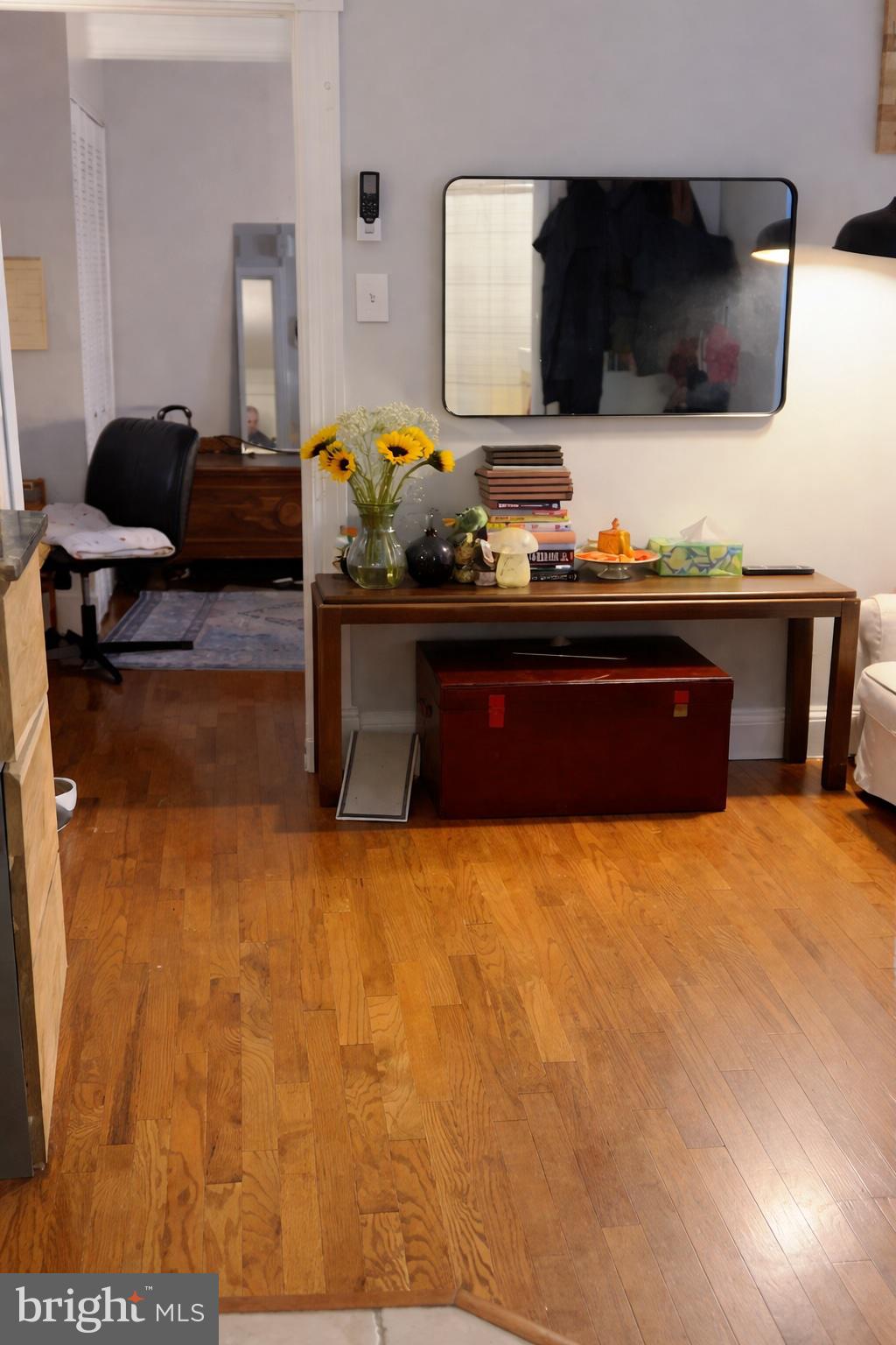 1227 Spruce Street, Unit 1R Philadelphia, PA 19107 - Photo 2 of 6 a living room with furniture and a flat screen tv