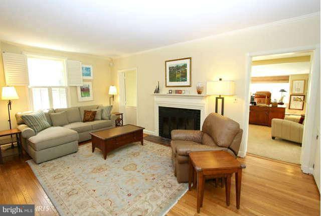 1200 Poplar Hill Road Baltimore, MD 21210 - Photo 2 of 18 a living room with furniture fireplace and a table