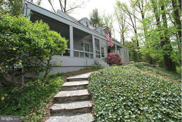 1200 Poplar Hill Road Baltimore, MD 21210 - Photo 18 of 18 a front view of a house with a yard and potted plants