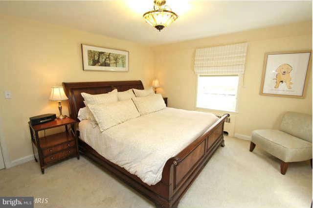 1200 Poplar Hill Road Baltimore, MD 21210 - Photo 7 of 18 a bed room with a bed and a couch