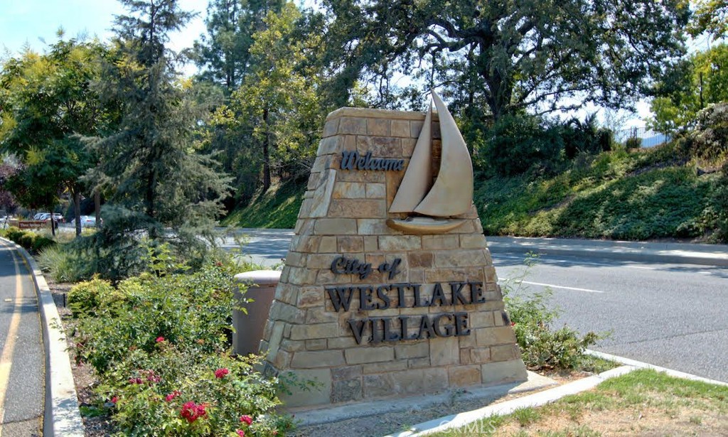 500 Lower Lake Road Westlake Village, CA 91361 - Photo 12 of 15 a view of a multi story residential apartment building with a yard and large trees