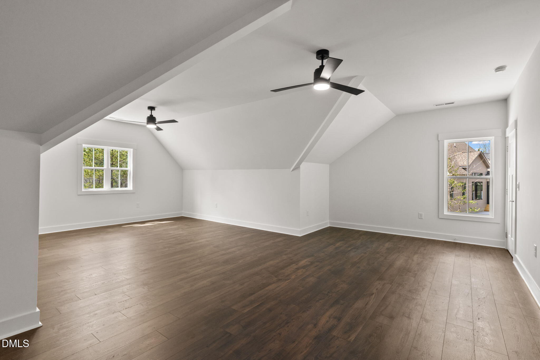 340 Pilot Ridge Road Zebulon, NC 27597 - Photo 41 of 53 a view of an empty room with wooden floor and a window