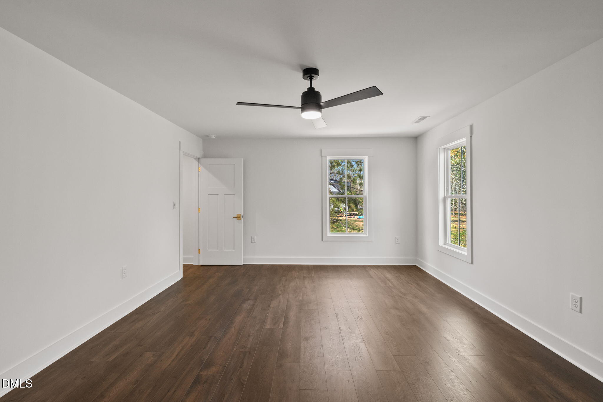 340 Pilot Ridge Road Zebulon, NC 27597 - Photo 45 of 53 a view of an empty room with wooden floor and a window