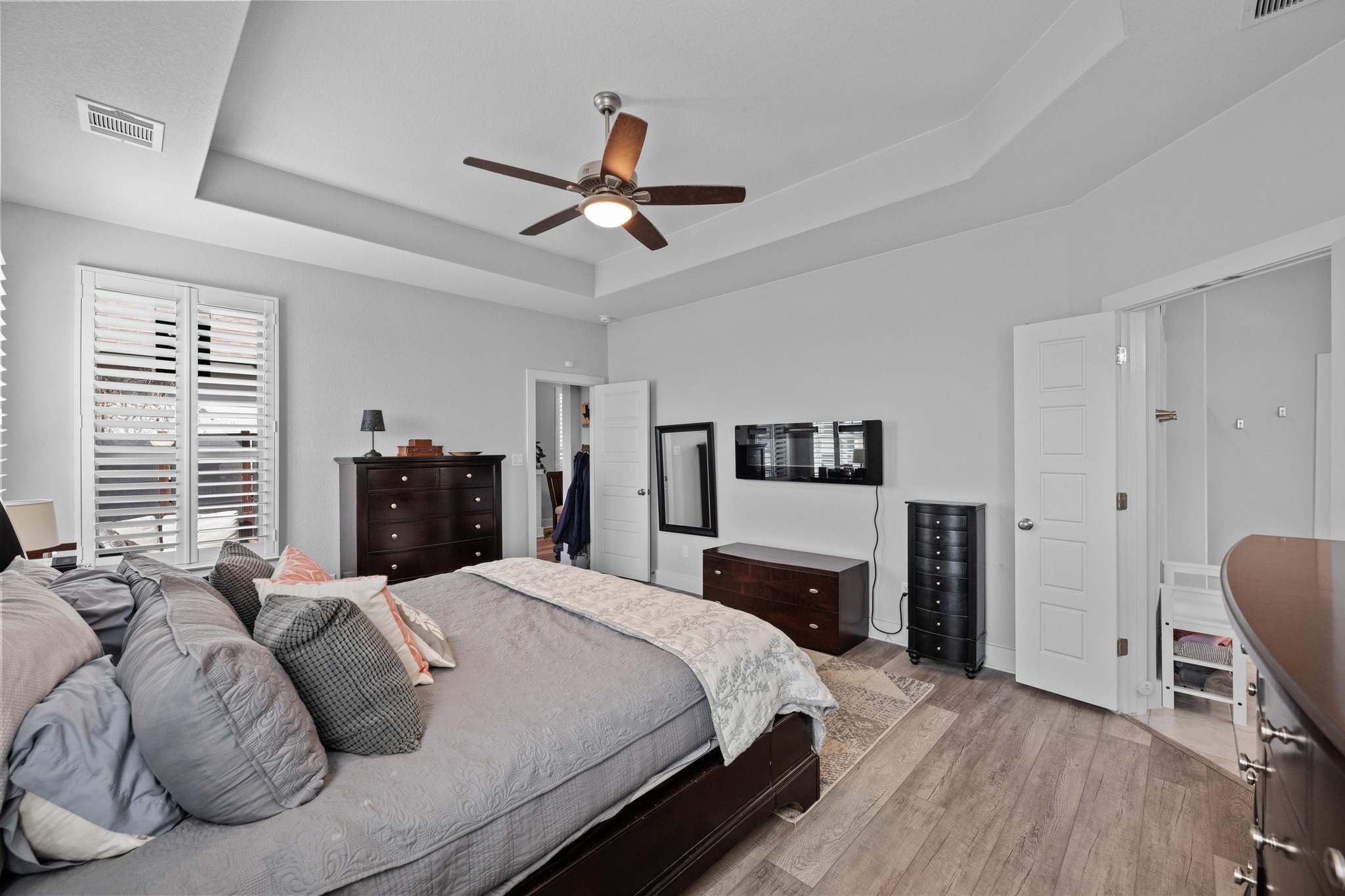 217 Palio Place Georgetown, TX 78628 - Photo 13 of 40 a bedroom with a bed dresser and a window